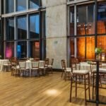 Luxurious hotel restaurant interior featuring elegant tables and chairs with ambient lighting.