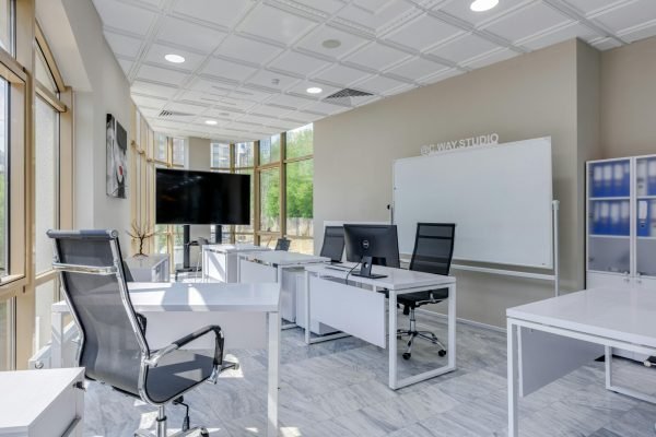 pexels-photo-7750129-7750129 Spacious and bright modern office interior with sleek furniture, ideal for professional workspaces.